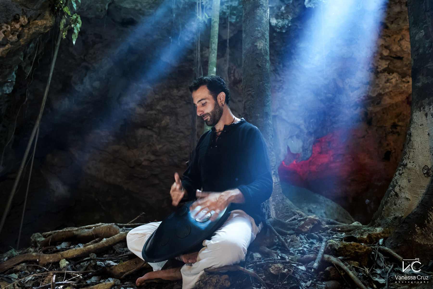 Musician playing in secret Cenote Riviera Maya Mexico