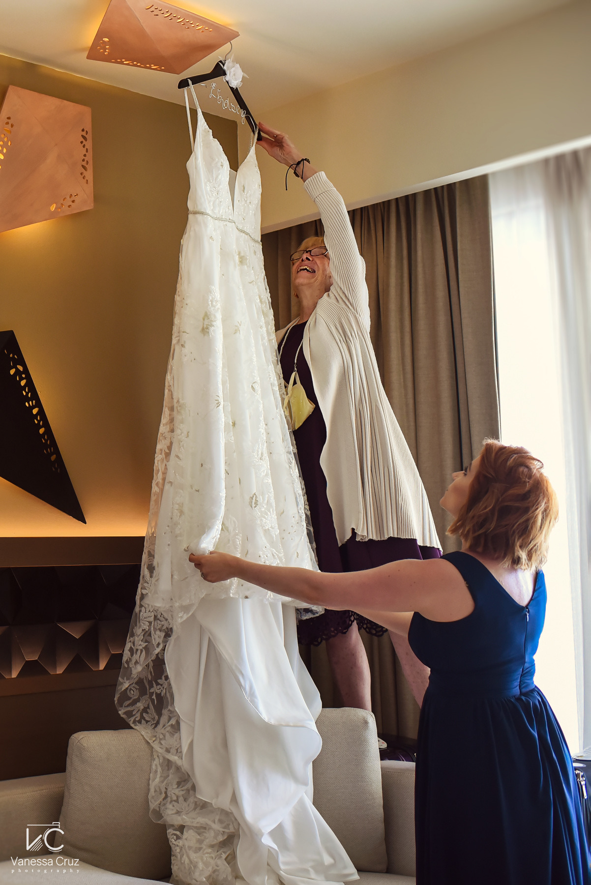Mom hanging wedding dress gettin ready Destination Wedding Hyatt Ziva Cancun Mexico